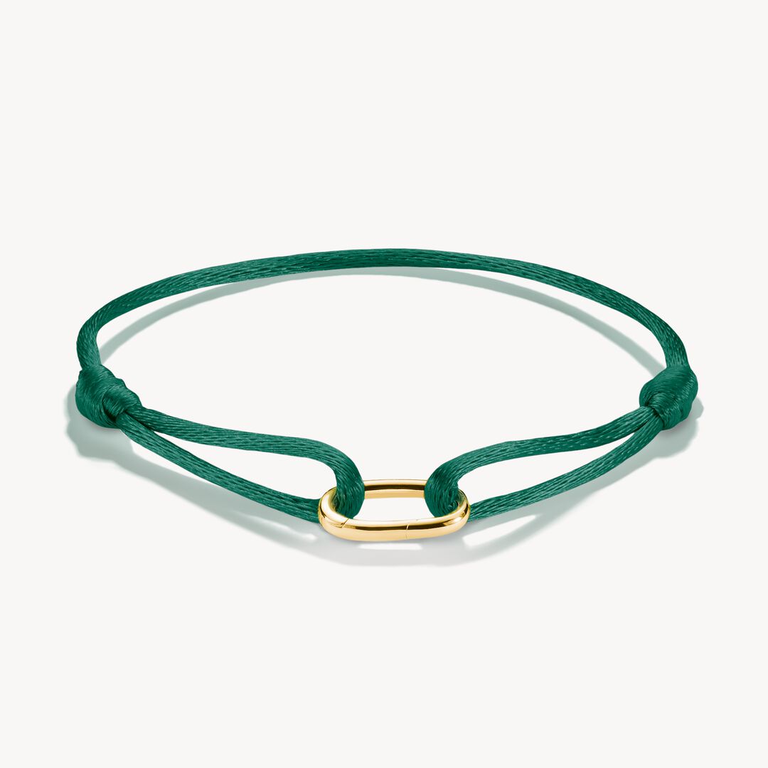 Green bracelet with a gold clasp on a white background
