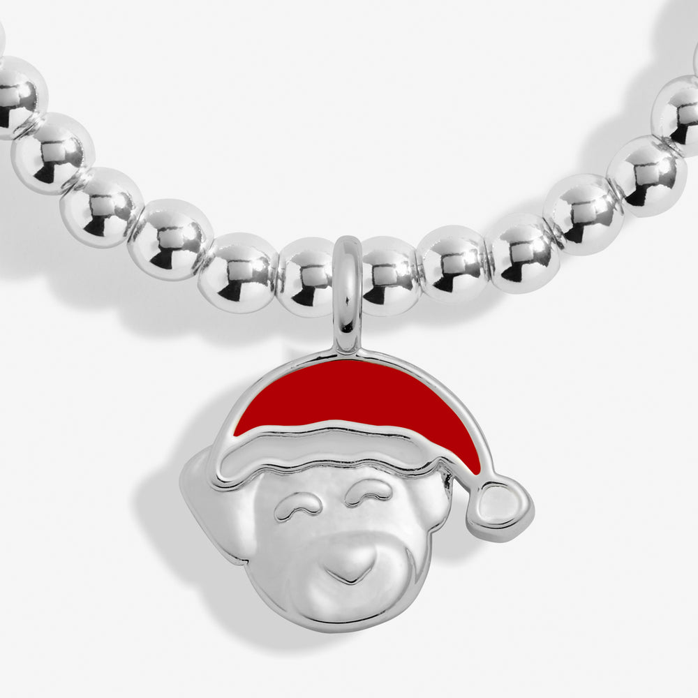 a silver necklace with a red santa hat on it