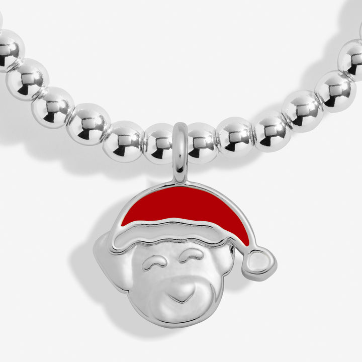 a silver necklace with a red santa hat on it