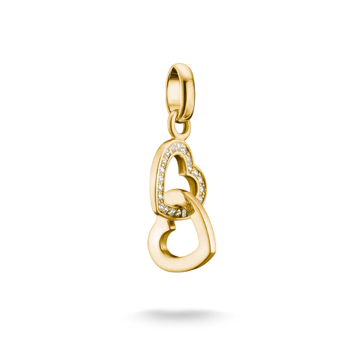 A gold heart-shaped pendant charm with a small border of clear stones, shown on a clean white background with a soft shadow underneath.