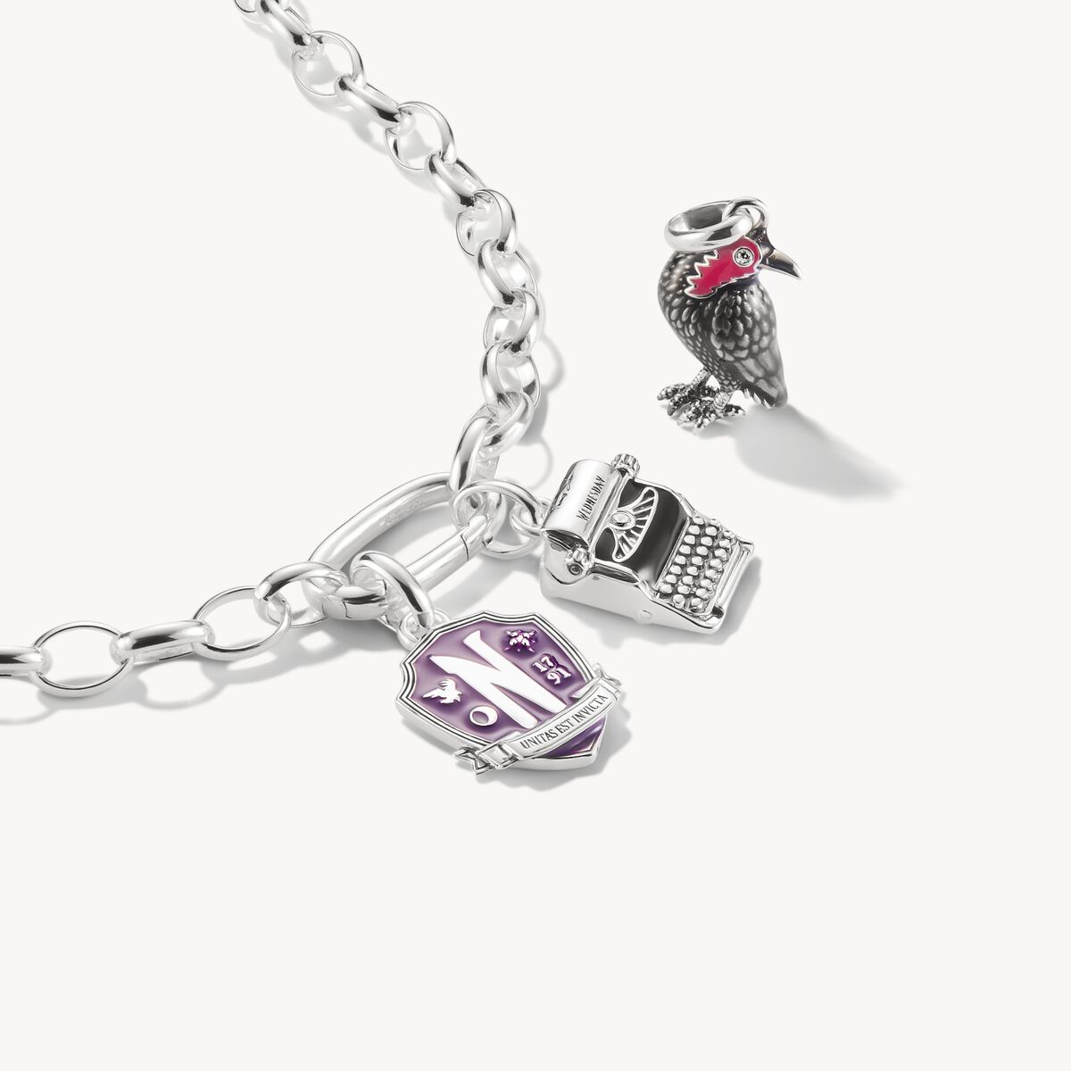 Silver bracelet with charms on a white background