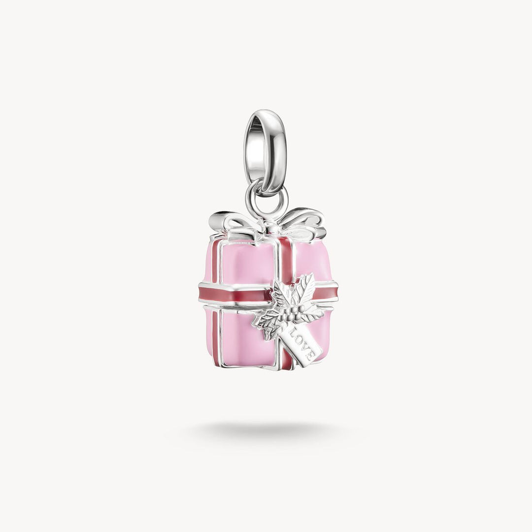 Silver pendant shaped like a pink gift box with a bow on a white background
