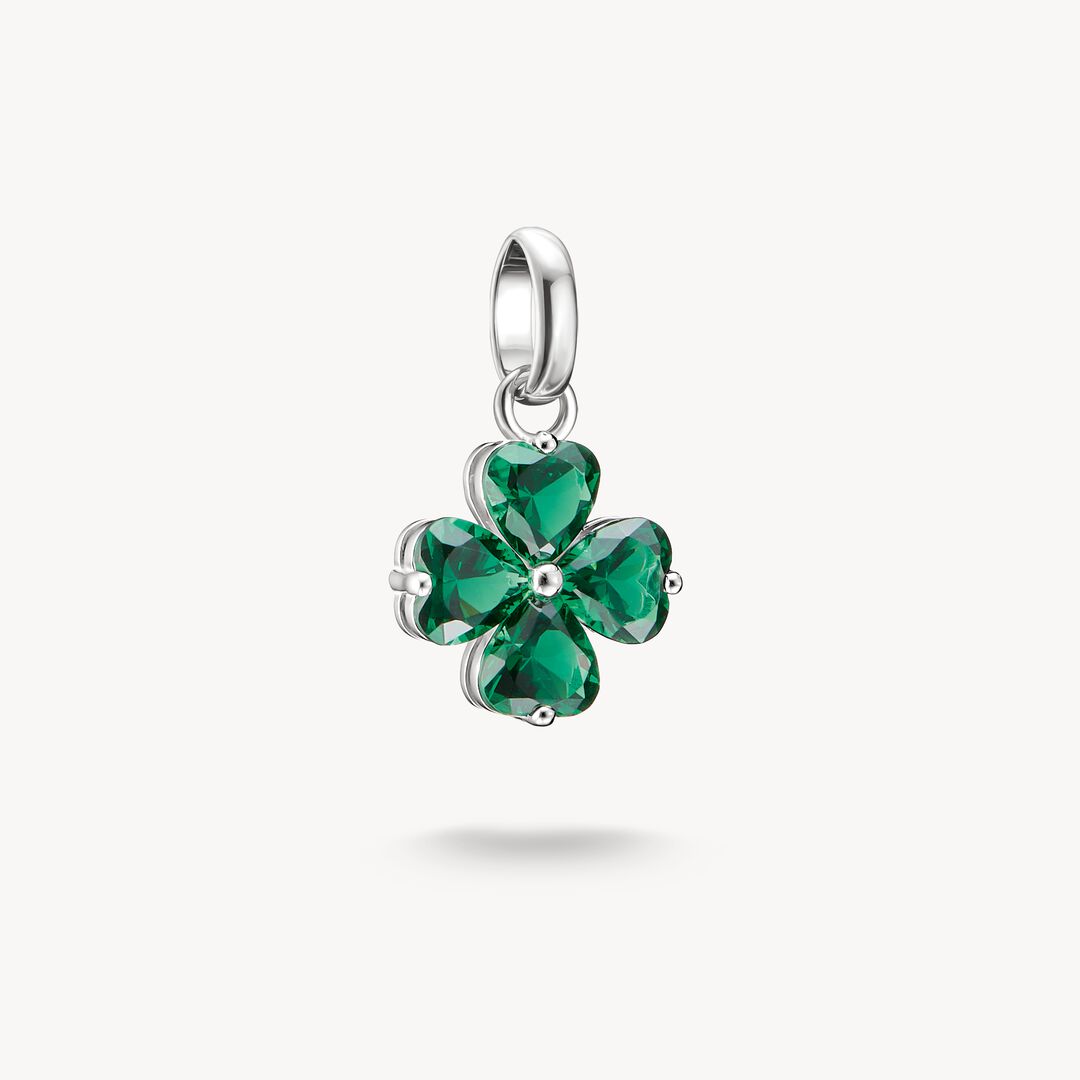 Green four-leaf clover pendant on a white background