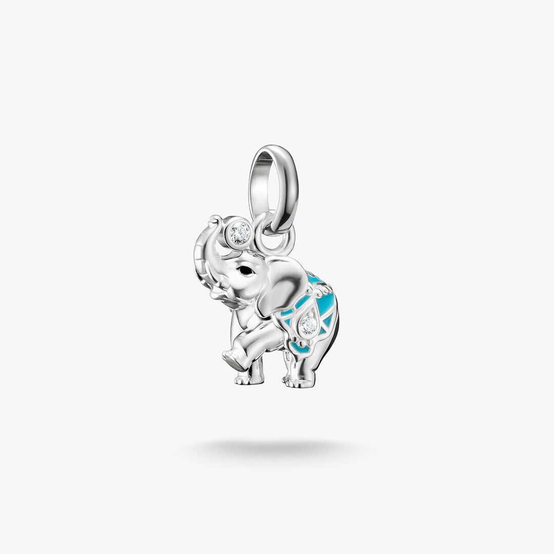 Silver elephant pendant with blue accents on a white background