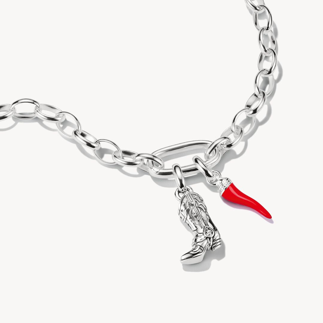 Red horn-shaped pendant with silver top on a white background