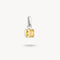 Silver pendant with a yellow gemstone on a white background