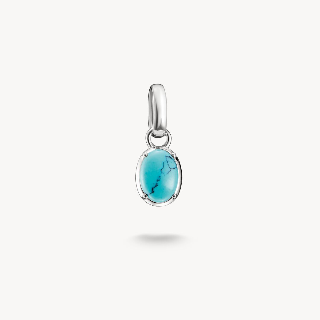 Silver pendant with a turquoise stone on a white background