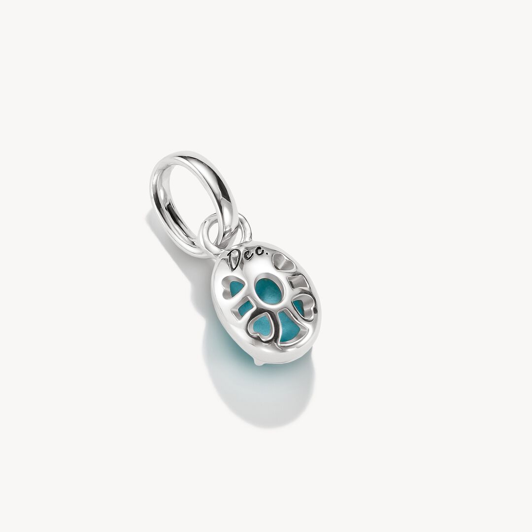 Silver pendant with a turquoise stone on a white background