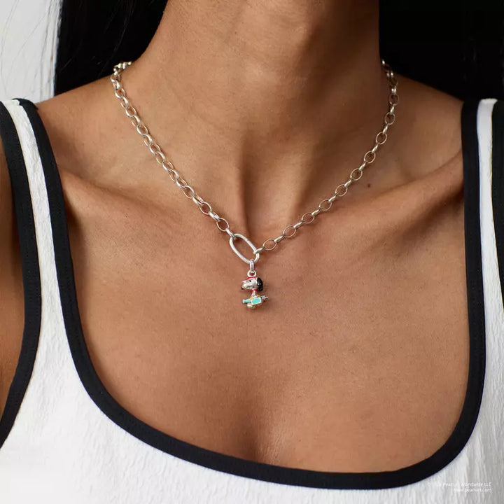 Necklace with a small pendant worn by a person