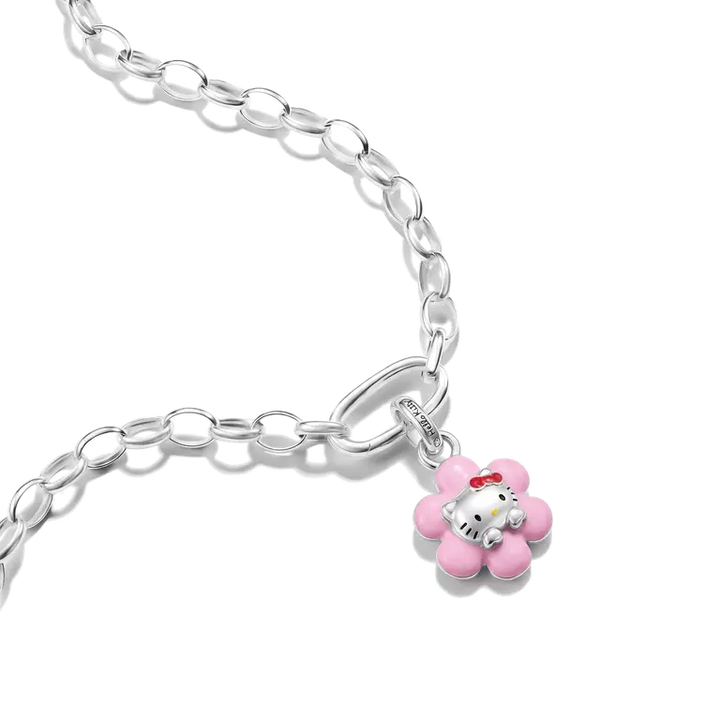 A silver chain bracelet featuring a pink flower charm with Hello Kitty sitting inside, shown on a clean white background.