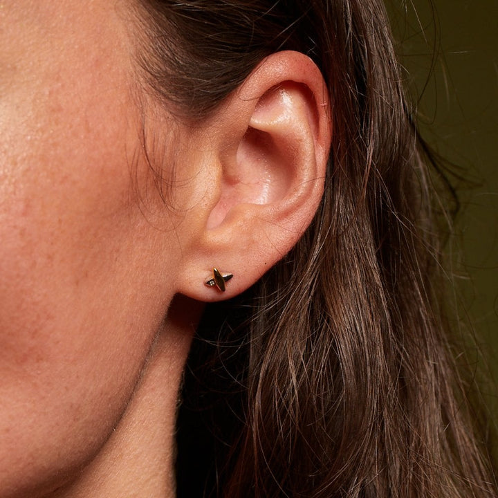Close-up of an ear with a small earring