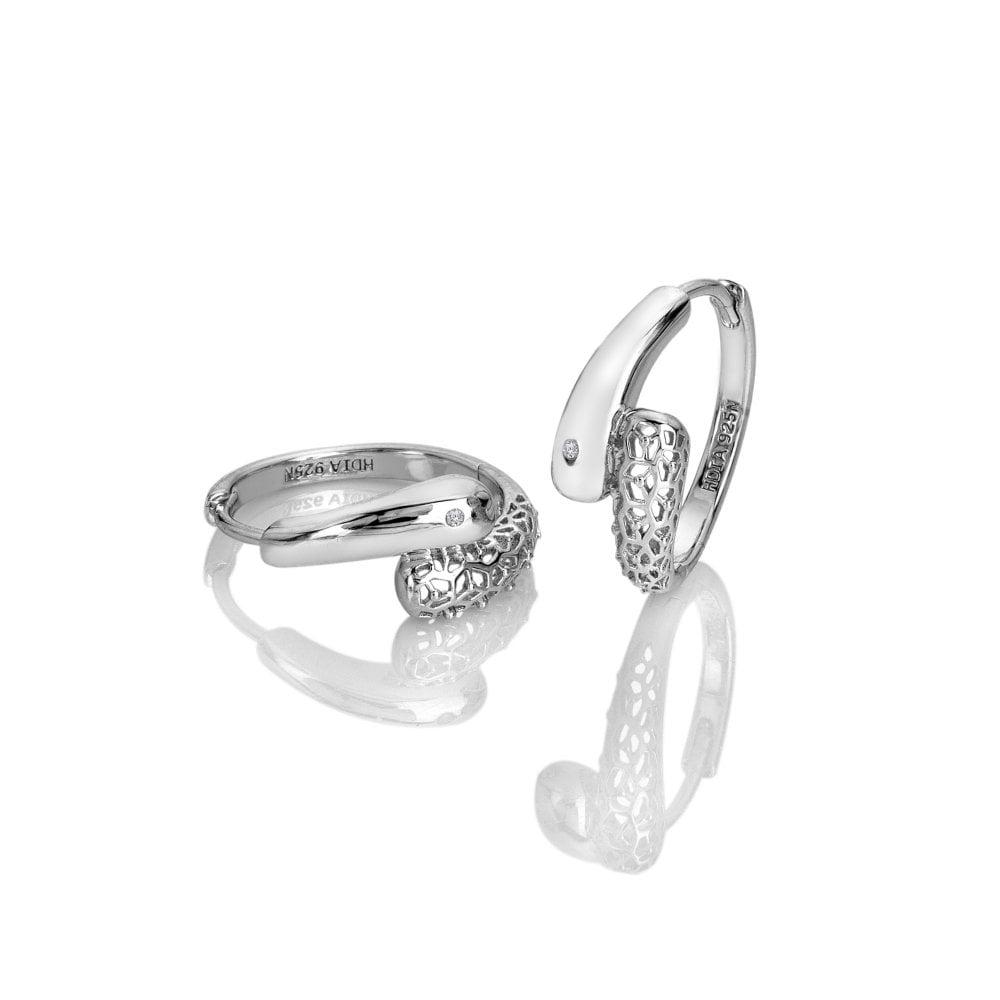 Two silver rings with intricate designs 