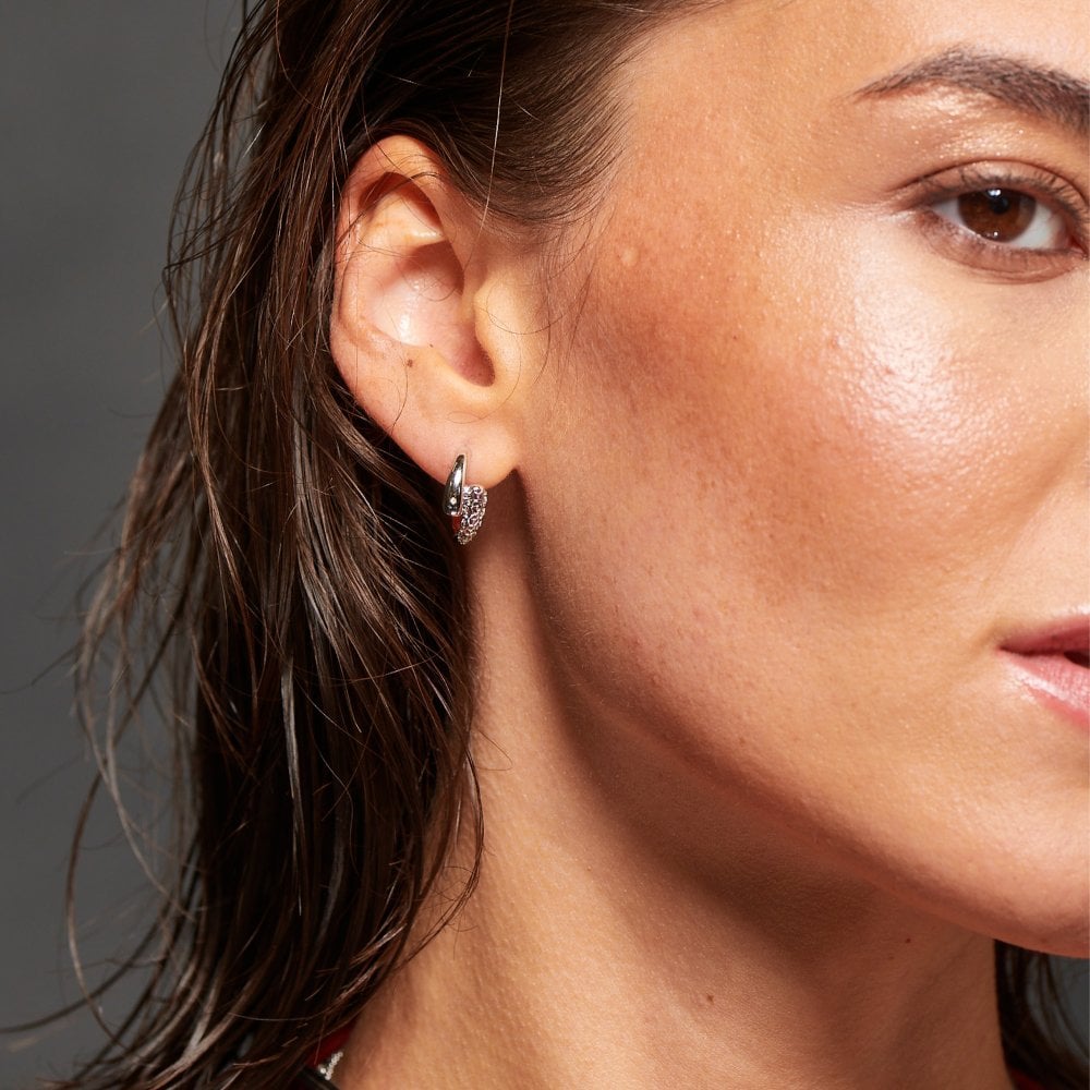 Close-up of a woman wearing a diamond earring 