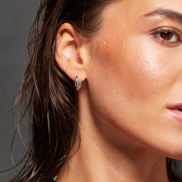 Close-up of a woman wearing a diamond earring 