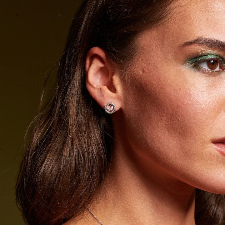 Close-up of a woman wearing a diamond earring 