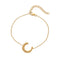 Gold bracelet with a crescent moon charm 
