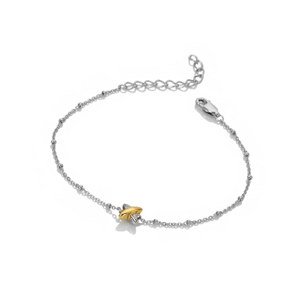 Silver bracelet with a gold heart charm 