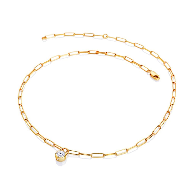 Gold chain necklace with a small round pendant