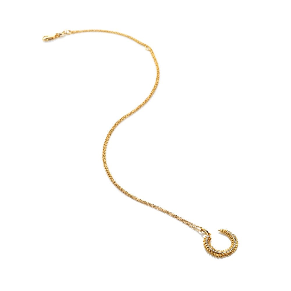 Gold necklace with a horse shoe-shaped pendant 