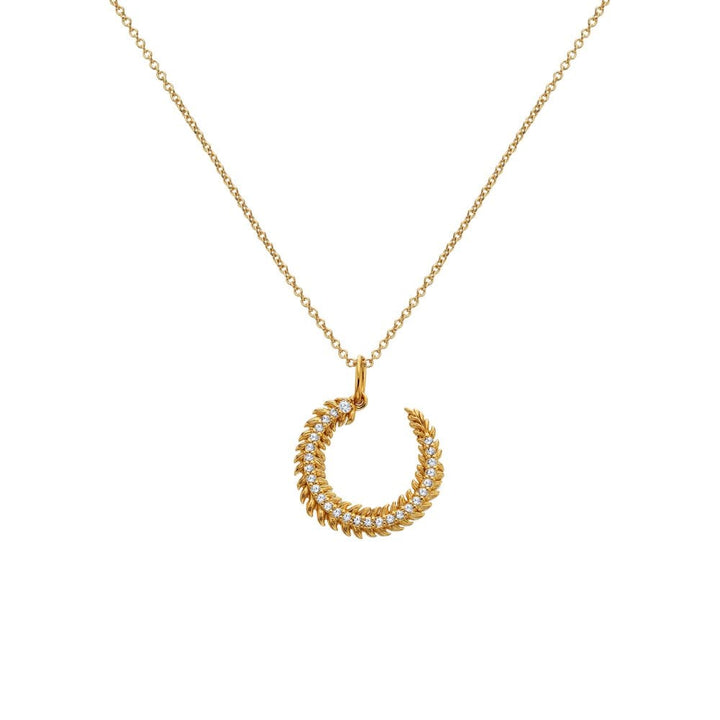 Gold necklace with a horse shoe-shaped pendant 