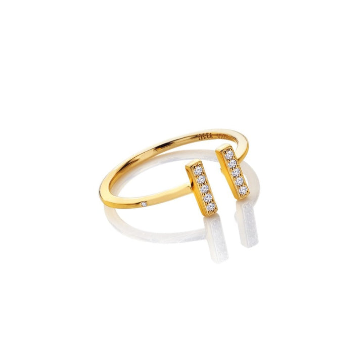 Gold ring with a white stone 