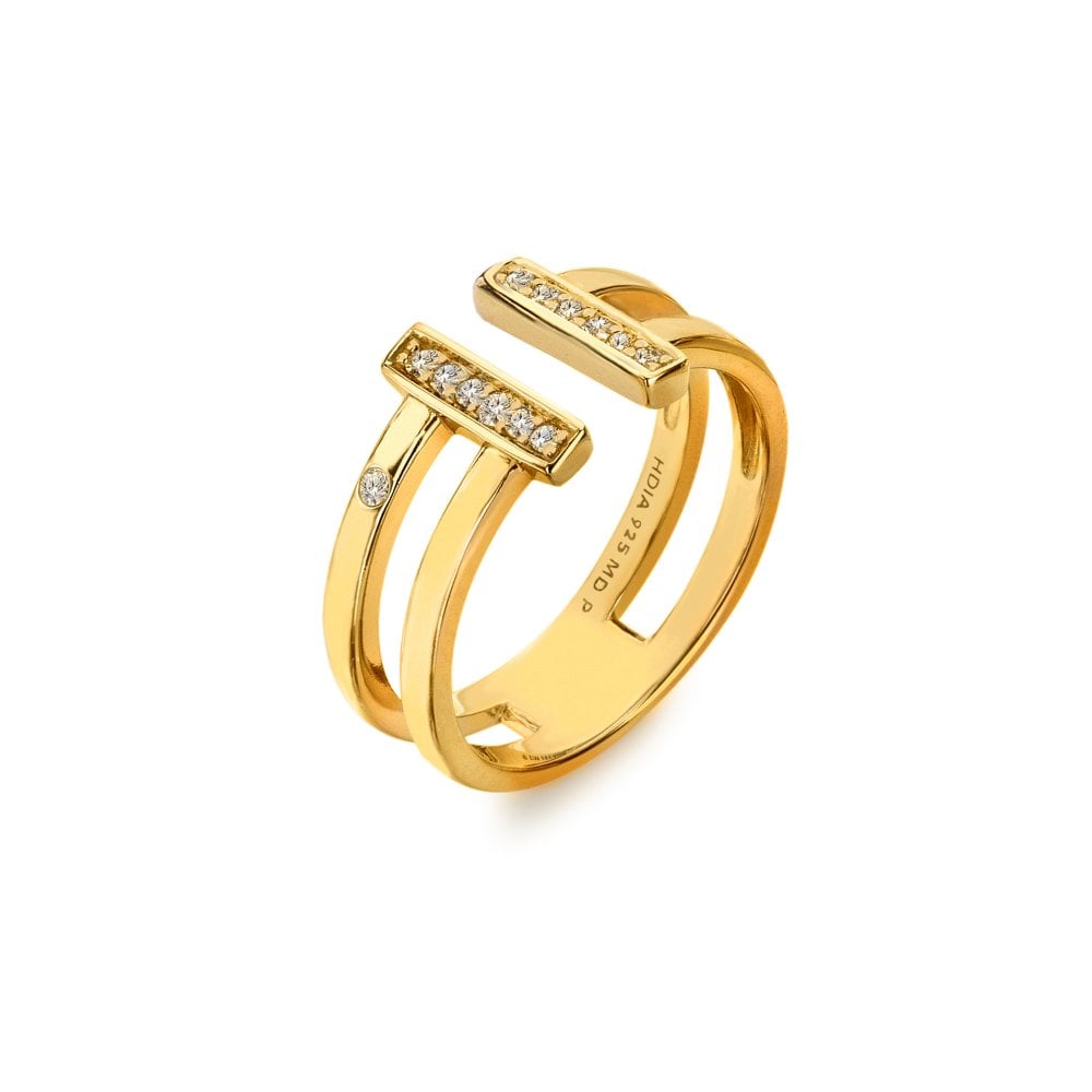 Gold ring with diamond accents on a white background