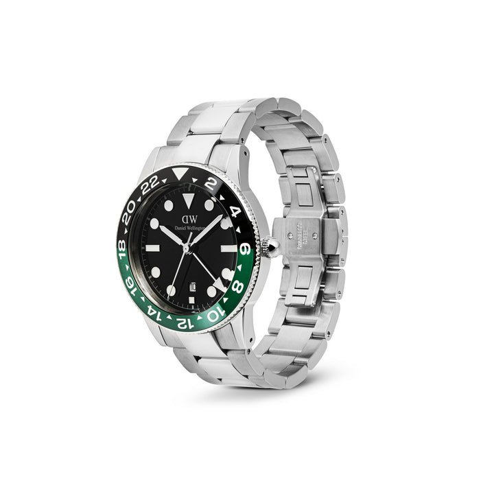 Silver watch with black and green face on a white background