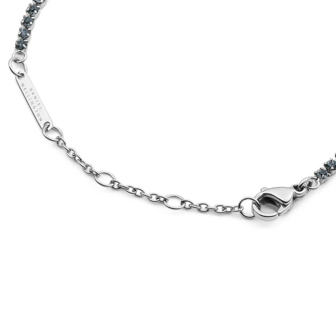 Silver bracelet with a clasp on a white background