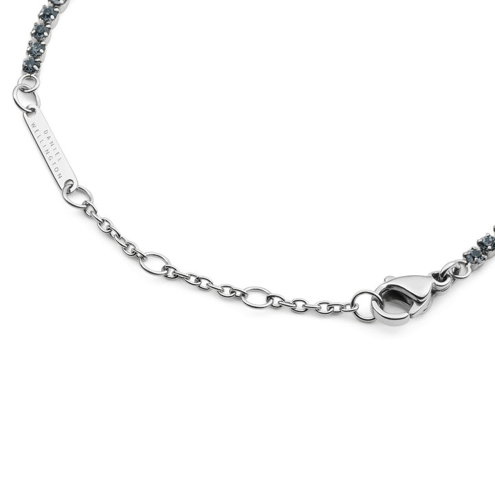 Silver bracelet with a clasp on a white background