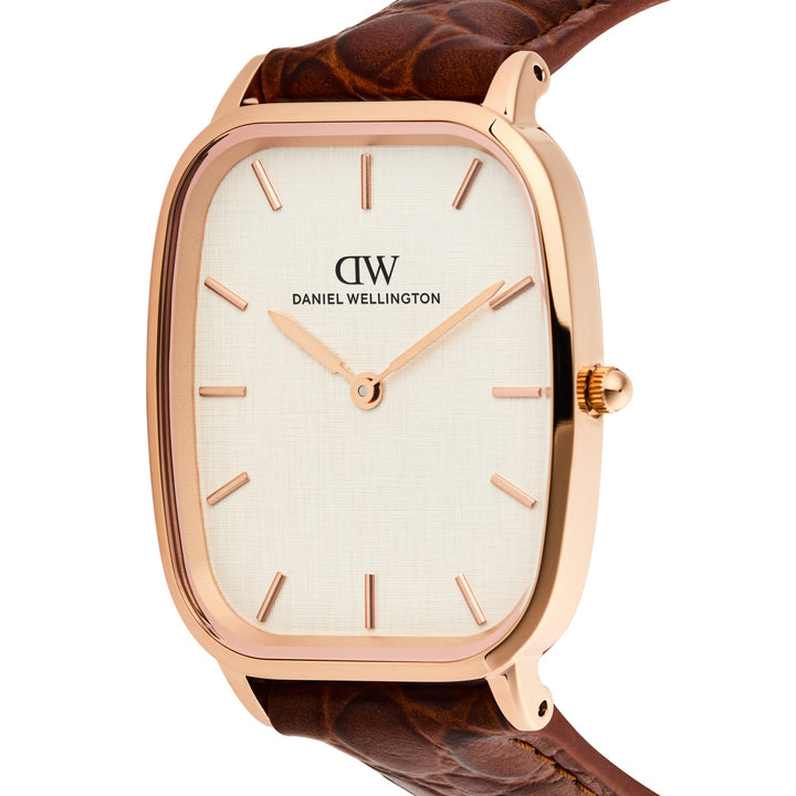 Daniel Wellington watch with a rectangular rose gold case, textured white dial, and brown leather strap on a white background.
