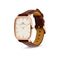 Daniel Wellington watch with a rose gold rectangular cushion-shaped case, cream dial, and brown crocodile-embossed leather strap, shown on a white background.