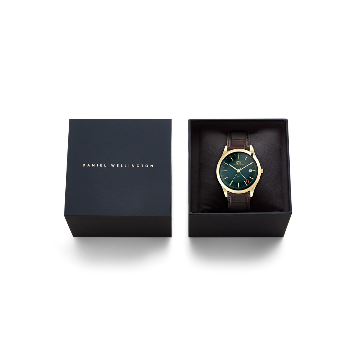 Daniel Wellington men's watch with a dark green dial, gold case, and brown leather strap, shown in its open black presentation box next to the branded lid on a white background.