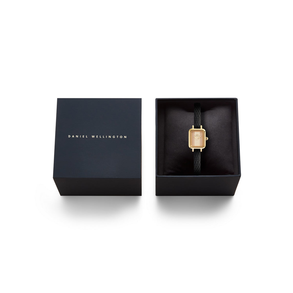 Gold watch in a black Daniel Wellington box on a white background