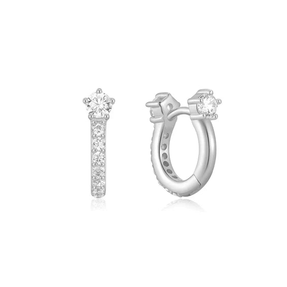 Silver earrings with clear gemstones on a white background