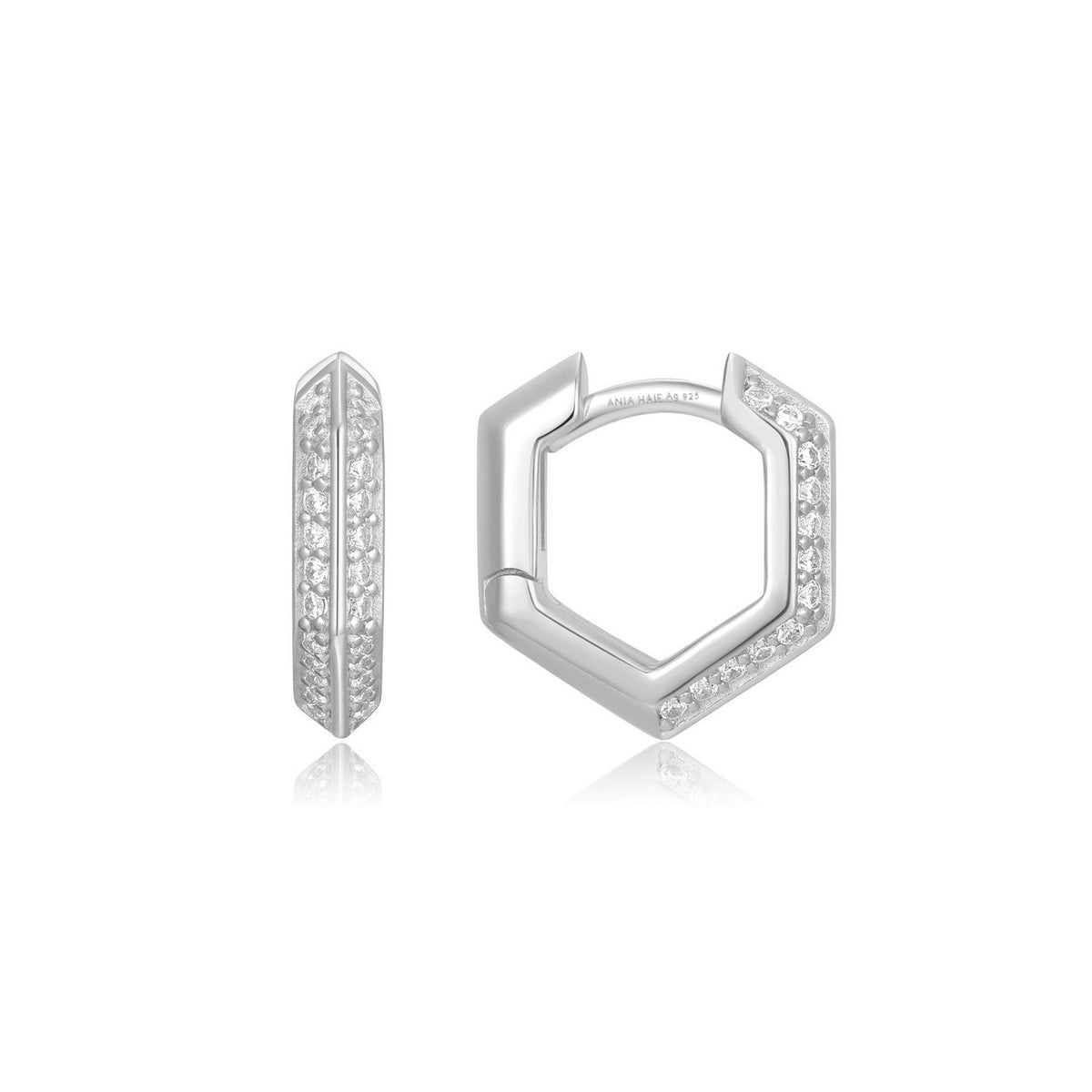Silver hoop earrings with small diamonds on a white background