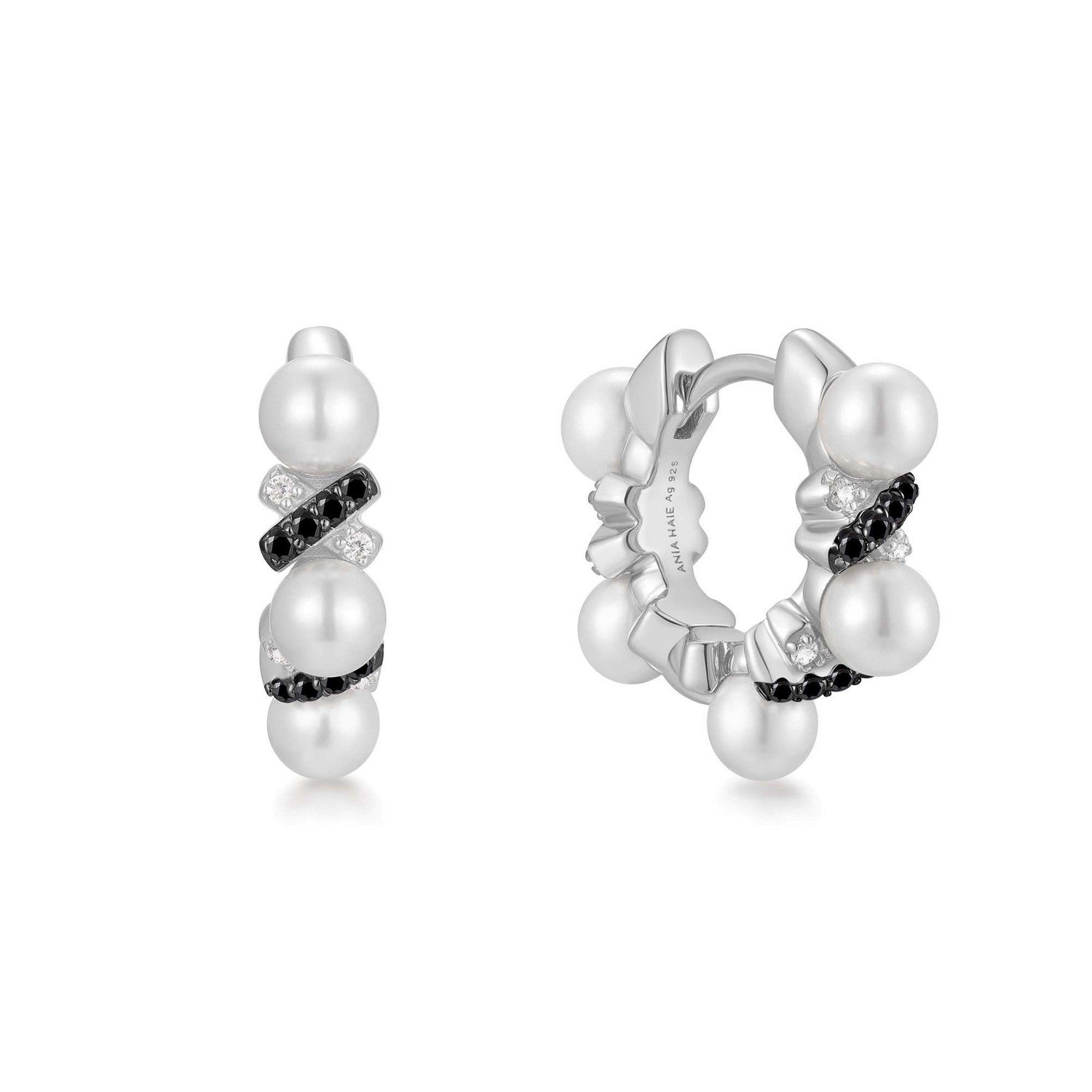 Pair of pearl hoop earrings on a white background