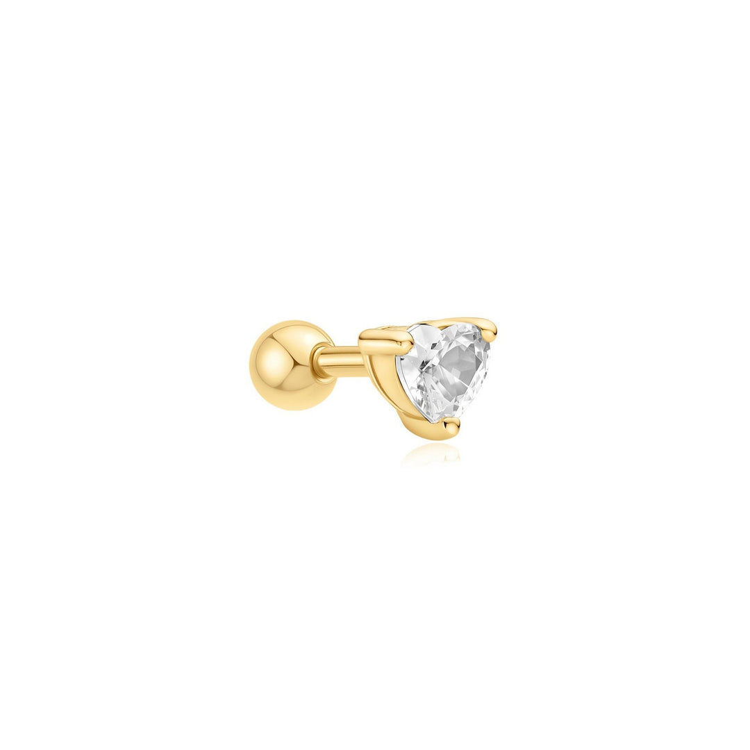 Gold earring with a clear gemstone on a white background