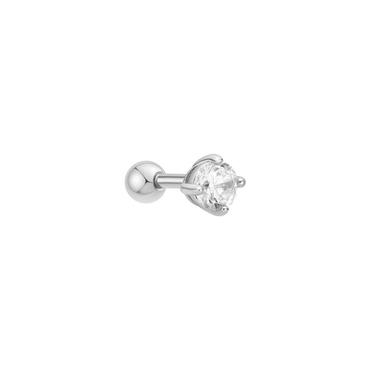 Single stud earring with a clear gemstone on a white background