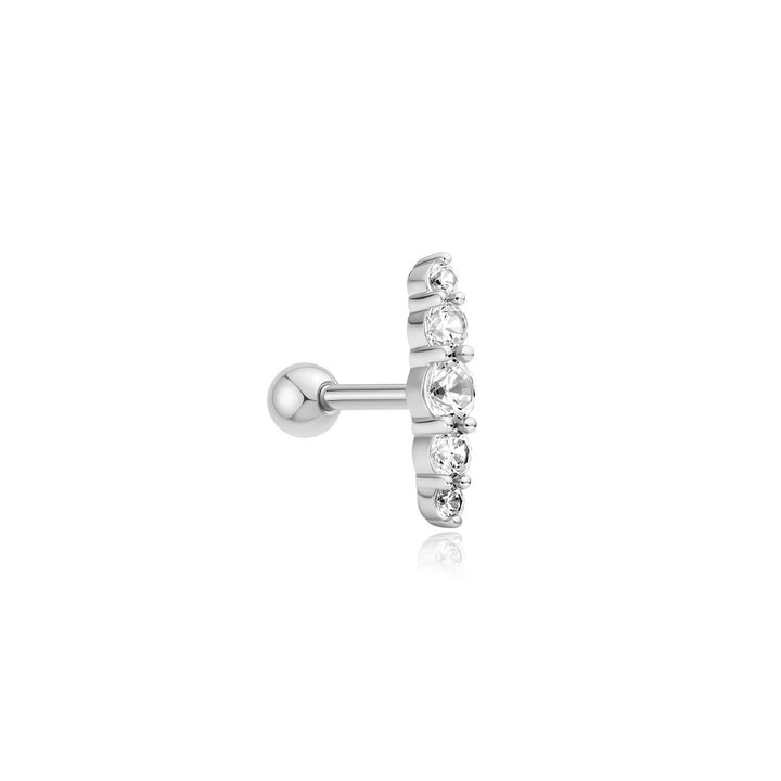 Silver earring with clear gemstones on a white background