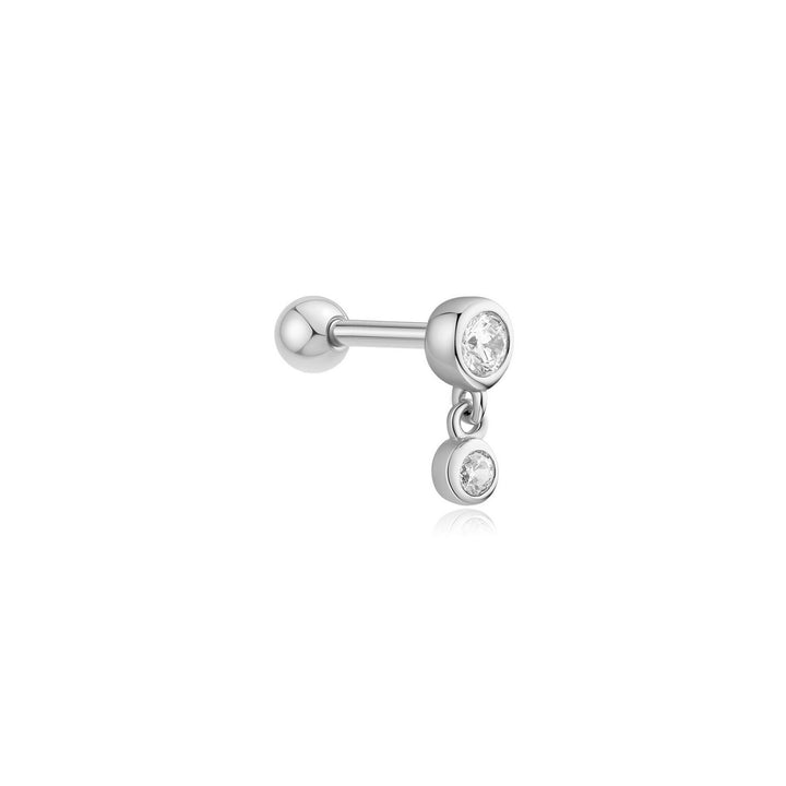 Silver earring with clear gemstones on a white background