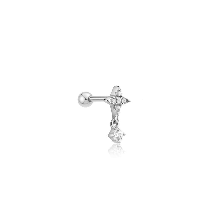 Silver earring with a small star design on a white background
