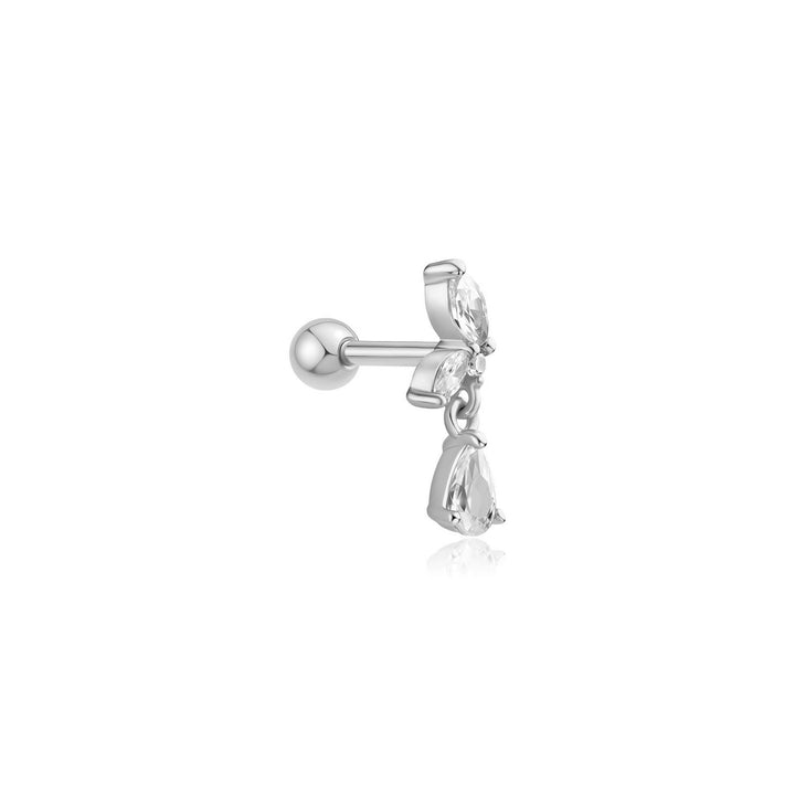 Silver earring with a small bow and clear gemstone on a white background