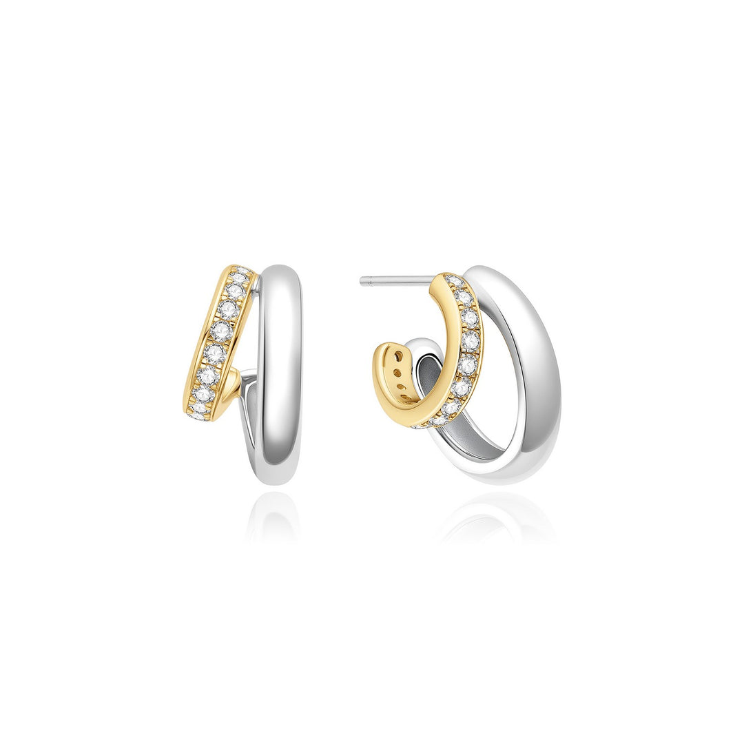 Pair of gold and silver hoop earrings on a white background