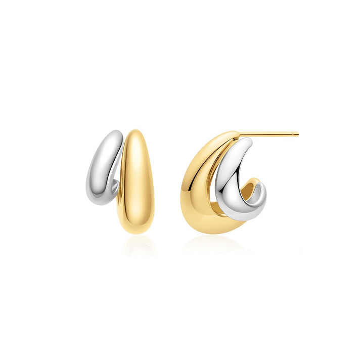 Pair of gold and silver hoop earrings on a white background