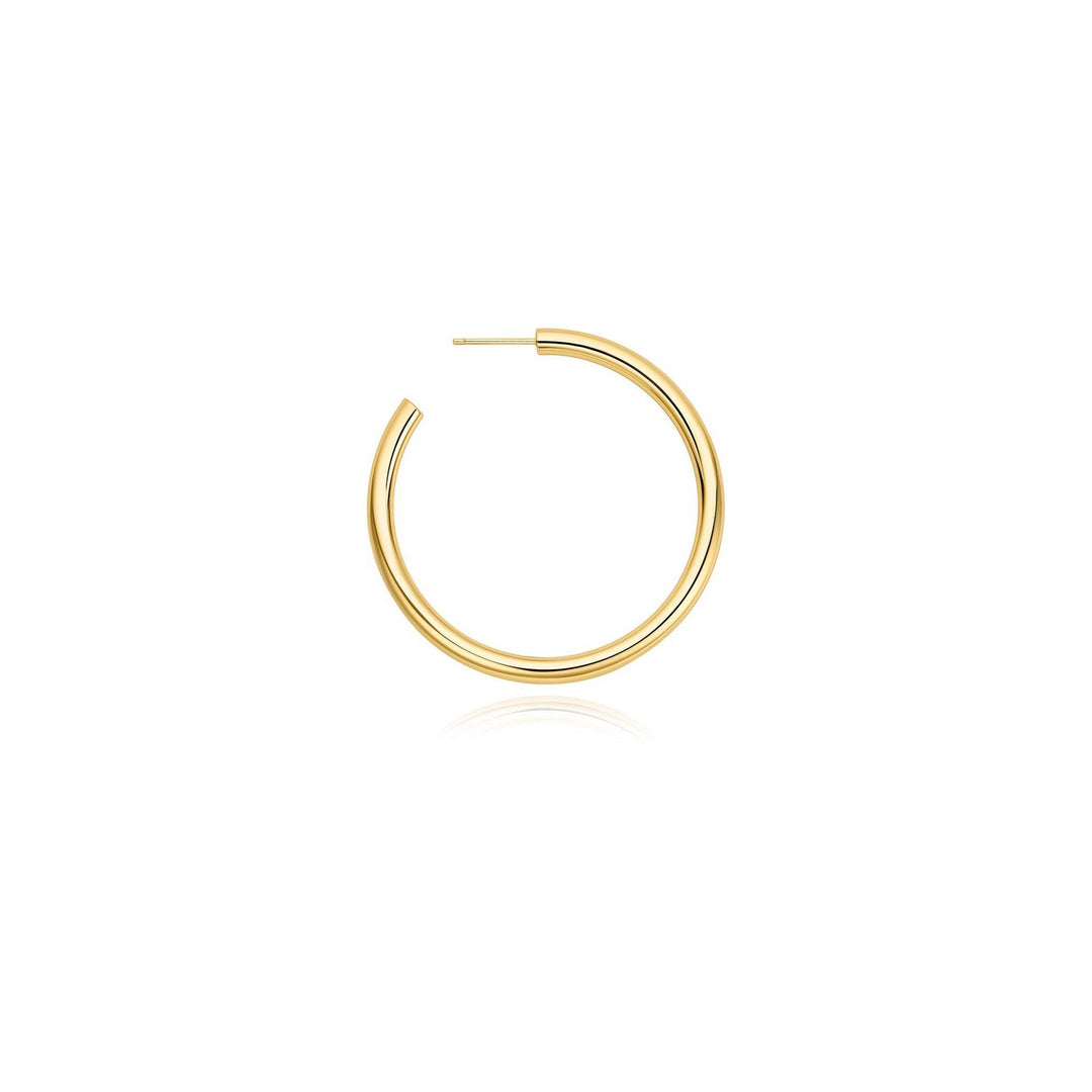 Gold hoop earring on a white background