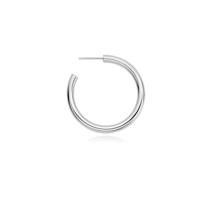 Silver hoop earring on a white background