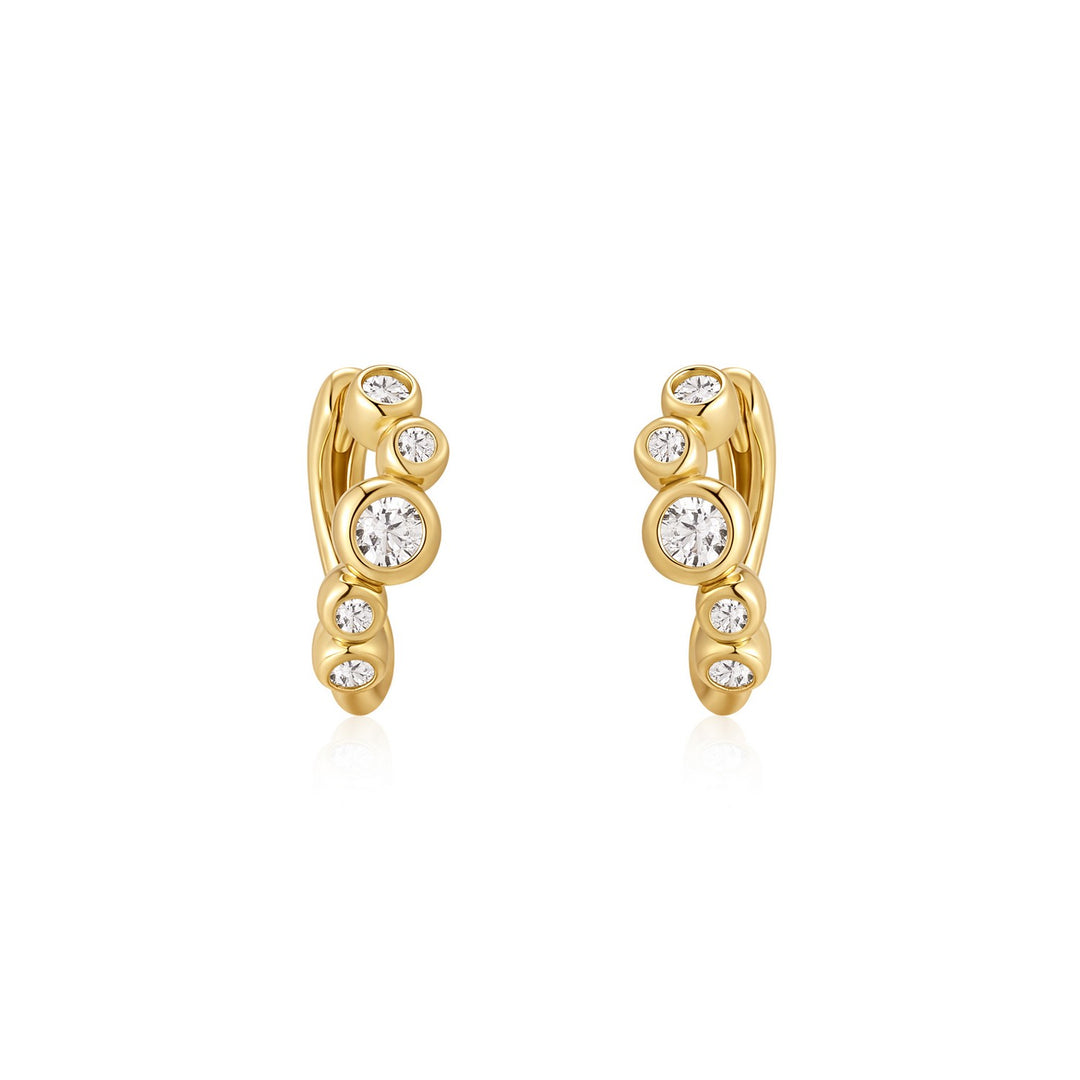 Gold earrings with embedded diamonds on a white background