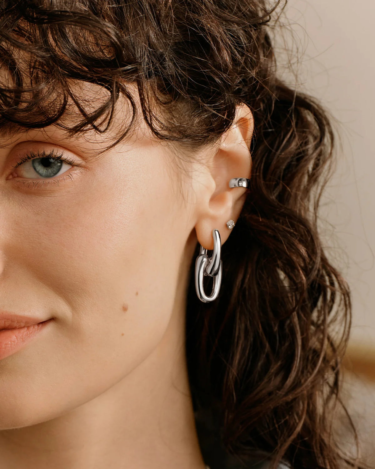 Ania Haie Fluid Light Silver Sculptural Interlocking Huggie Hoop Earrings E078-15H