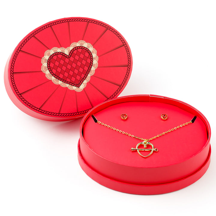 Red jewelry box with gold necklace and earrings on a white background