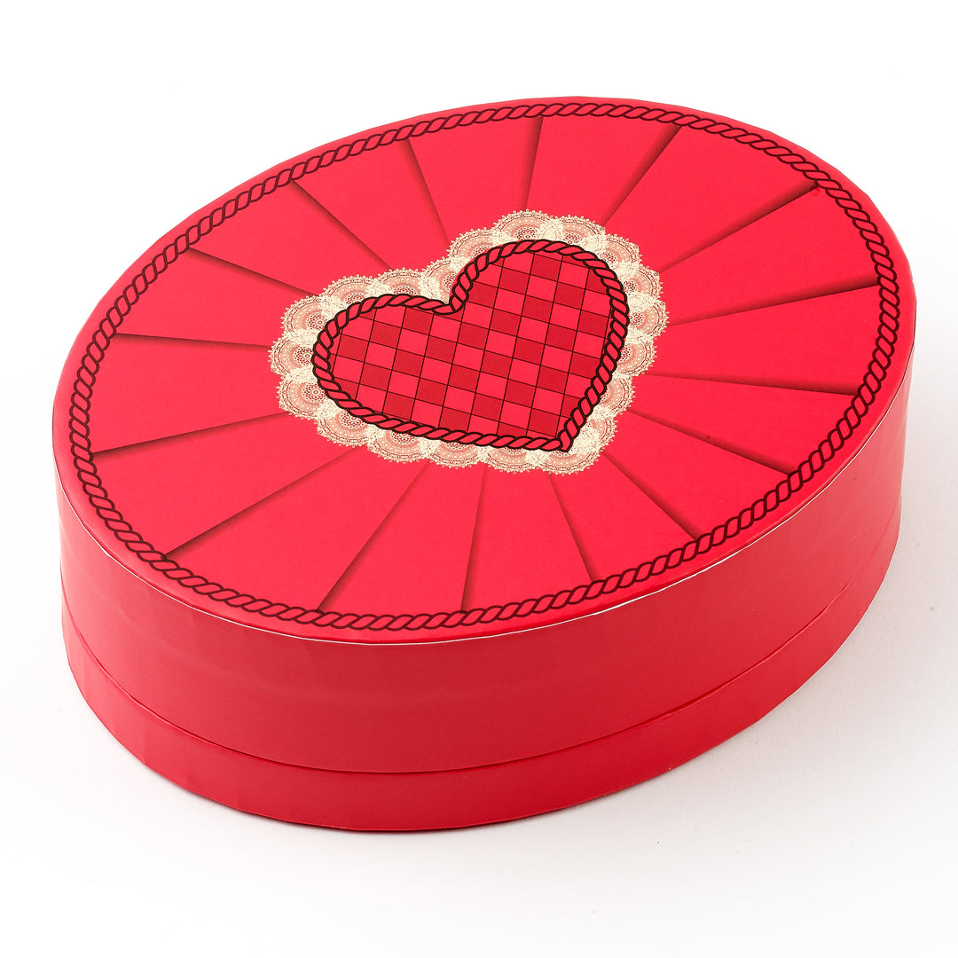 Red heart-shaped box with a decorative heart design on a white background